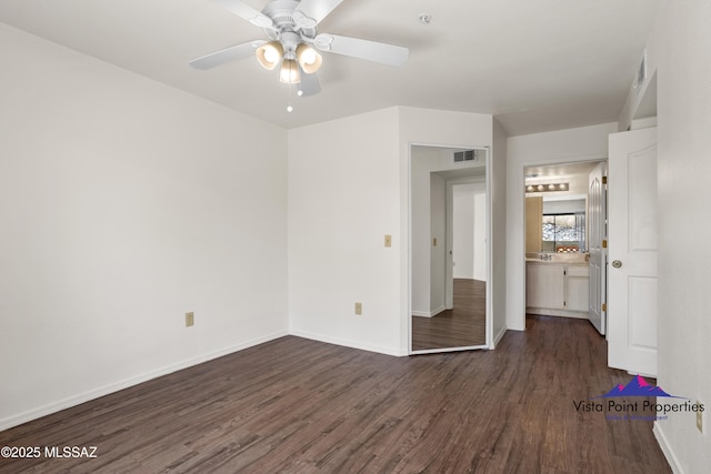 5751 N Kolb Rd # 22103, Tucson, AZ 85750 - spare room with dark wood-style flooring, a ceiling fan, and baseboards