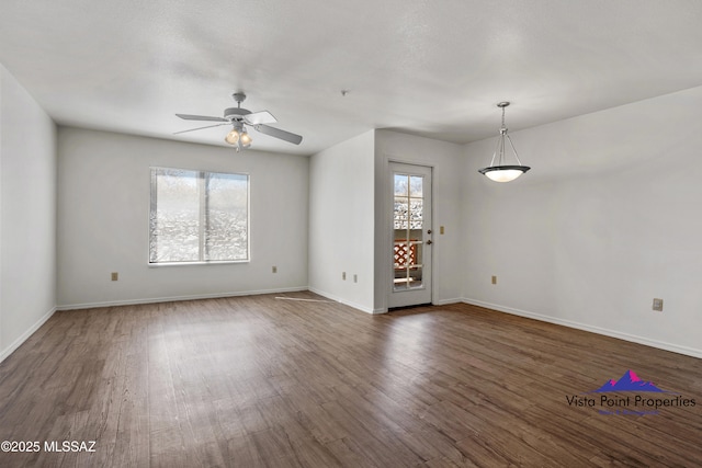 5751 N Kolb Rd # 22103, Tucson, AZ 85750 - unfurnished room featuring dark wood-style flooring, ceiling fan, and baseboards