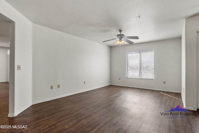 5751 N Kolb Rd # 22103, Tucson, AZ 85750 - spare room featuring a ceiling fan, dark wood-style floors, and baseboards