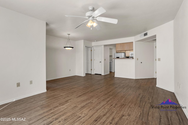 5751 N Kolb Rd # 22103, Tucson, AZ 85750 - unfurnished living room with dark wood-type flooring, a ceiling fan, and baseboards