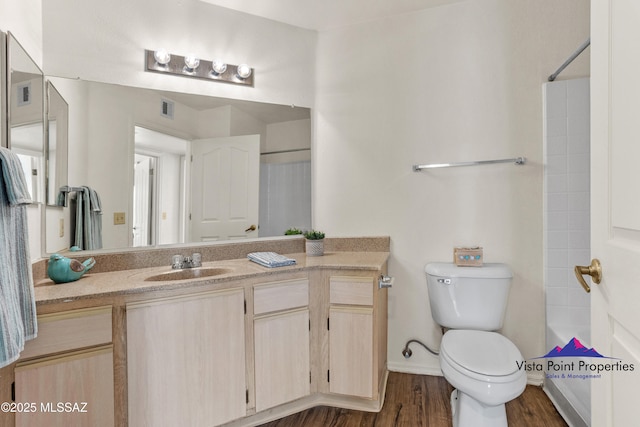 5751 N Kolb Rd # 22103, Tucson, AZ 85750 - bathroom featuring vanity, toilet, wood finished floors, baseboards, and shower / bathtub combination