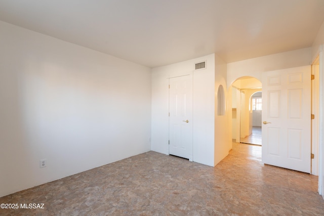 6335 N Barcelona Ln Unit 713, Tucson, AZ 85704 - unfurnished bedroom featuring arched walkways