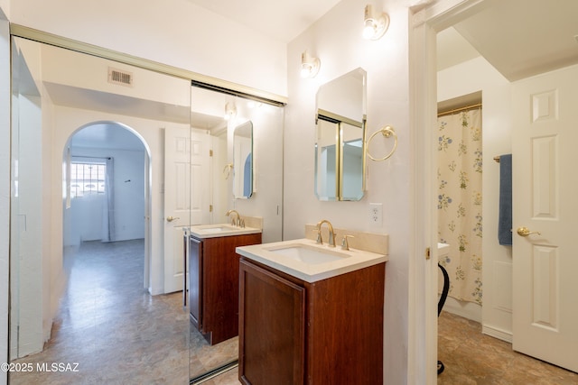 6335 N Barcelona Ln Unit 713, Tucson, AZ 85704 - bathroom with two vanities and a shower with curtain