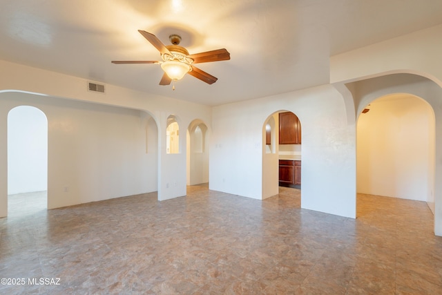6335 N Barcelona Ln Unit 713, Tucson, AZ 85704 - empty room featuring arched walkways and ceiling fan