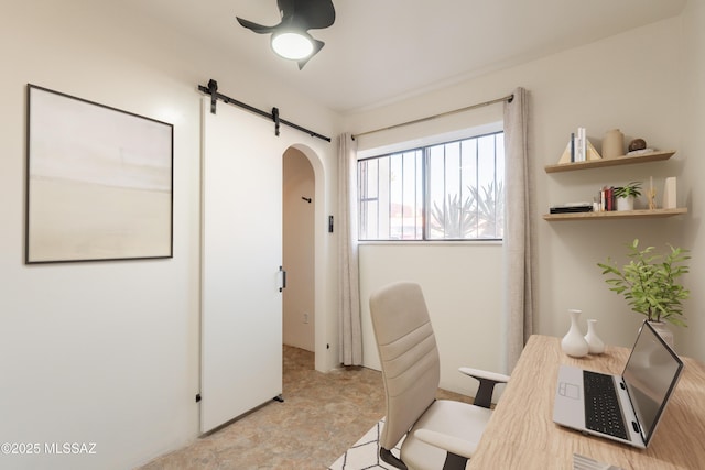 6335 N Barcelona Ln Unit 713, Tucson, AZ 85704 - office area with arched walkways, a ceiling fan, and a barn door