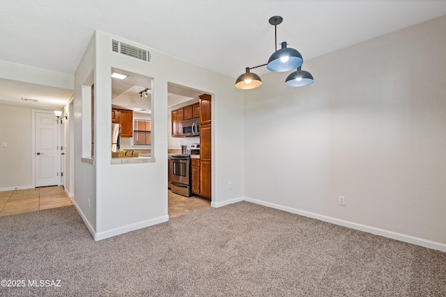 6651 N Campbell Ave Apt 221, Tucson, AZ 85718 - unfurnished room with light colored carpet and baseboards