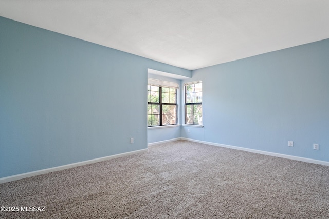 6651 N Campbell Ave Apt 221, Tucson, AZ 85718 - carpeted spare room featuring baseboards