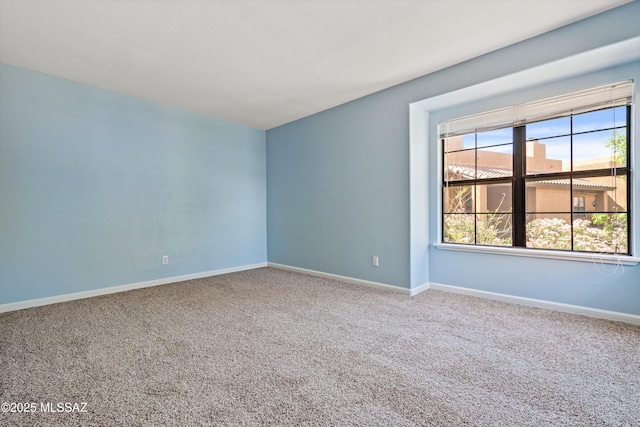 6651 N Campbell Ave Apt 221, Tucson, AZ 85718 - carpeted empty room featuring baseboards
