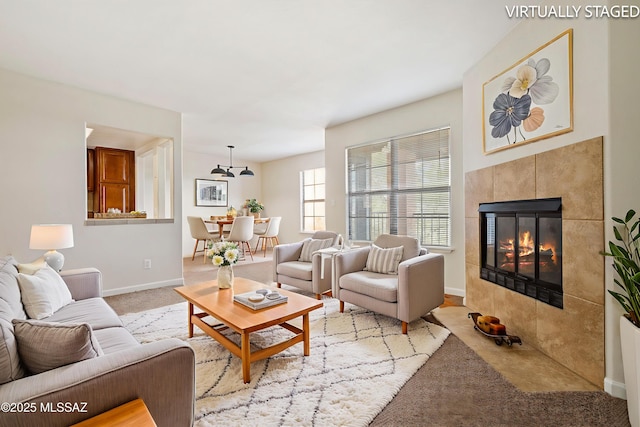 6651 N Campbell Ave Apt 221, Tucson, AZ 85718 - living room with a fireplace and baseboards