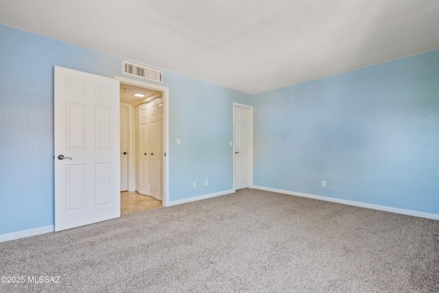 6651 N Campbell Ave Apt 221, Tucson, AZ 85718 - carpeted empty room with baseboards