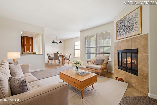 6651 N Campbell Ave Apt 221, Tucson, AZ 85718 - living room with baseboards and a tile fireplace