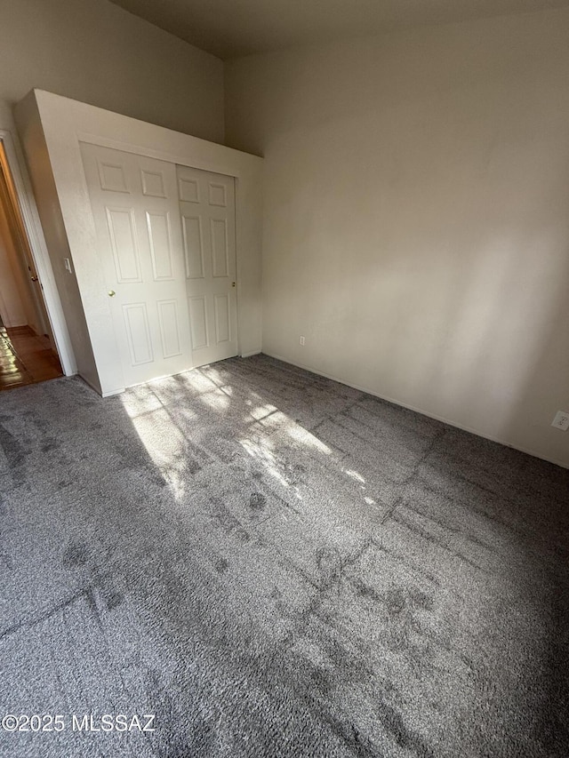5640 N Placita Favorita, Tucson, AZ 85750 - unfurnished bedroom with carpet floors and a closet