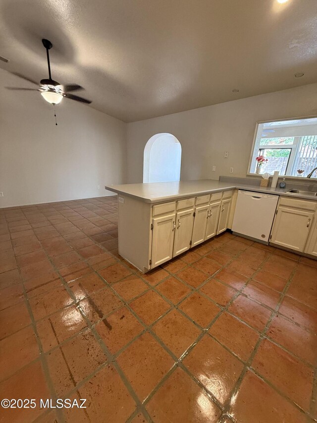 5640 N Placita Favorita, Tucson, AZ 85750 - kitchen featuring white dishwasher, a ceiling fan, light countertops, a sink, and a peninsula
