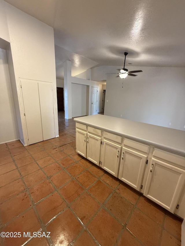 5640 N Placita Favorita, Tucson, AZ 85750 - kitchen featuring vaulted ceiling, a ceiling fan, and light countertops