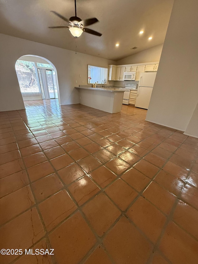 5640 N Placita Favorita, Tucson, AZ 85750 - unfurnished living room with light tile patterned floors, arched walkways, a ceiling fan, vaulted ceiling, and recessed lighting