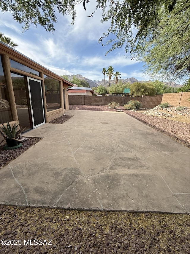 5640 N Placita Favorita, Tucson, AZ 85750 - fenced backyard with a mountain view and a patio area