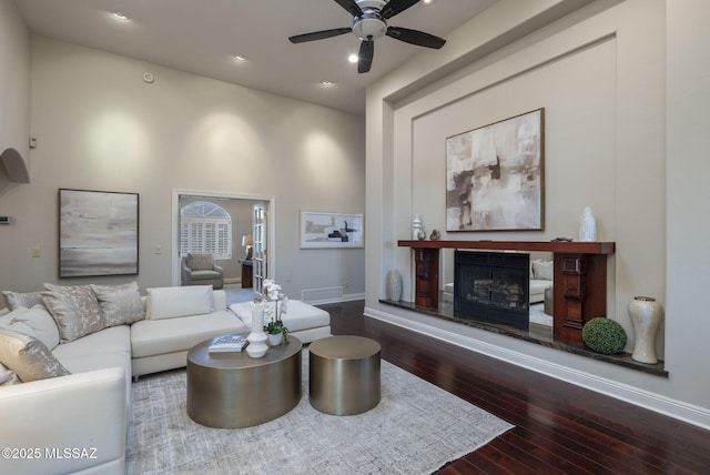 3750 E Sumo Quinto, Tucson, AZ 85718 - living area with hardwood / wood-style flooring, a glass covered fireplace, baseboards, ceiling fan, and recessed lighting