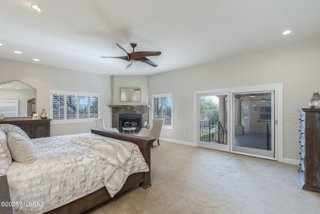 3750 E Sumo Quinto, Tucson, AZ 85718 - bedroom featuring access to outside, a fireplace, multiple windows, light carpet, and recessed lighting