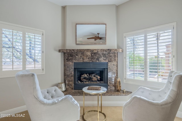 3750 E Sumo Quinto, Tucson, AZ 85718 - living area with a fireplace, plenty of natural light, and baseboards