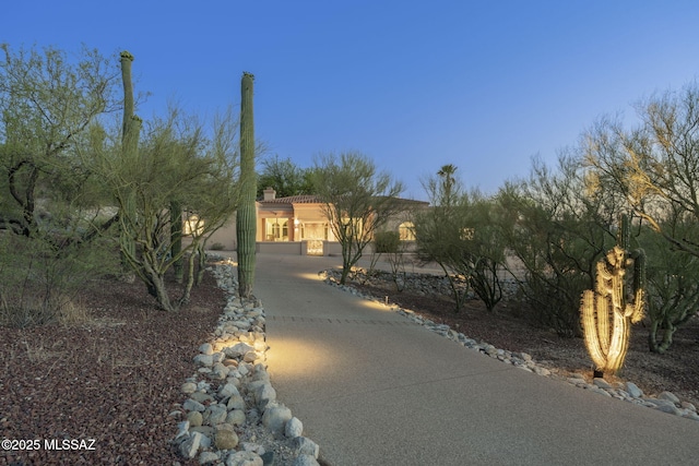 3750 E Sumo Quinto, Tucson, AZ 85718 - view of front of house with stucco siding, a chimney, and a tiled roof