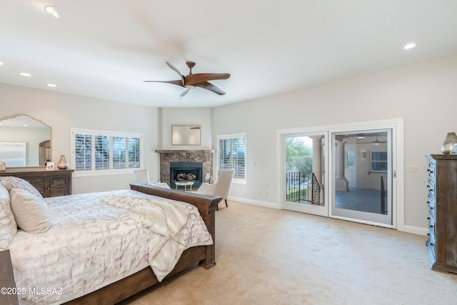3750 E Sumo Quinto, Tucson, AZ 85718 - bedroom featuring access to outside, a fireplace, light carpet, recessed lighting, and baseboards