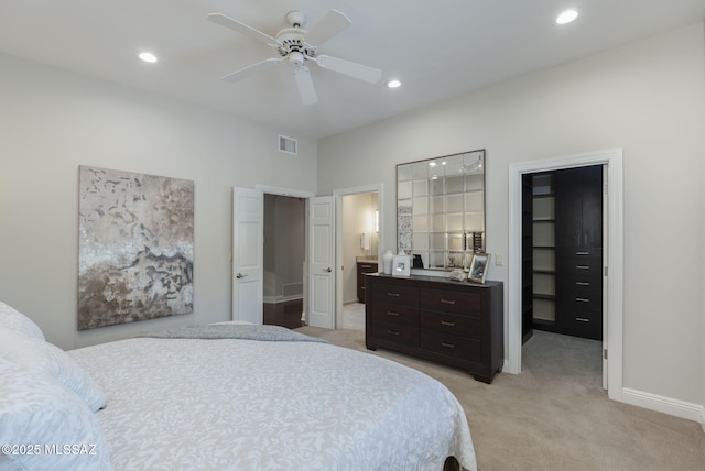 3750 E Sumo Quinto, Tucson, AZ 85718 - bedroom featuring a walk in closet, light carpet, recessed lighting, baseboards, and a closet