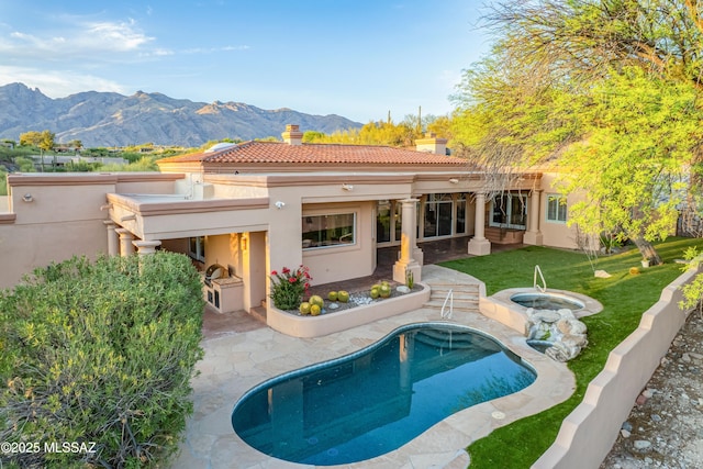 3750 E Sumo Quinto, Tucson, AZ 85718 - back of house featuring a chimney, a mountain view, stucco siding, a patio area, and a tile roof