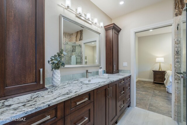 3750 E Sumo Quinto, Tucson, AZ 85718 - full bathroom with vanity, a stall shower, connected bathroom, baseboards, and recessed lighting