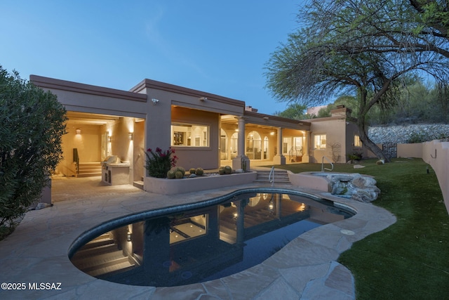 3750 E Sumo Quinto, Tucson, AZ 85718 - rear view of house with stucco siding, a patio area, an outdoor pool, and a yard