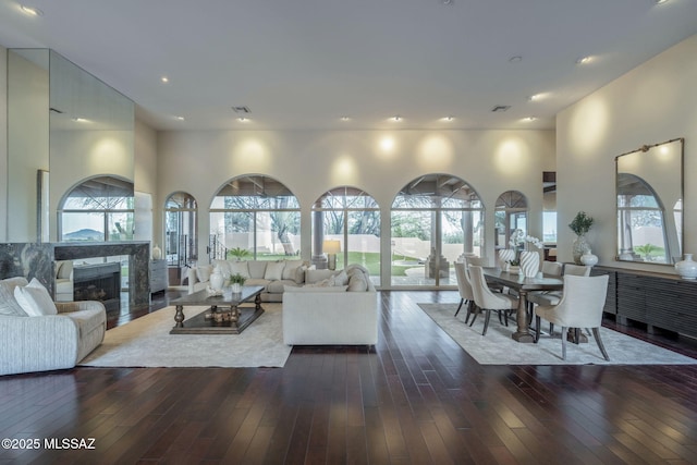 3750 E Sumo Quinto, Tucson, AZ 85718 - living room with a high end fireplace, dark wood-style floors, and recessed lighting