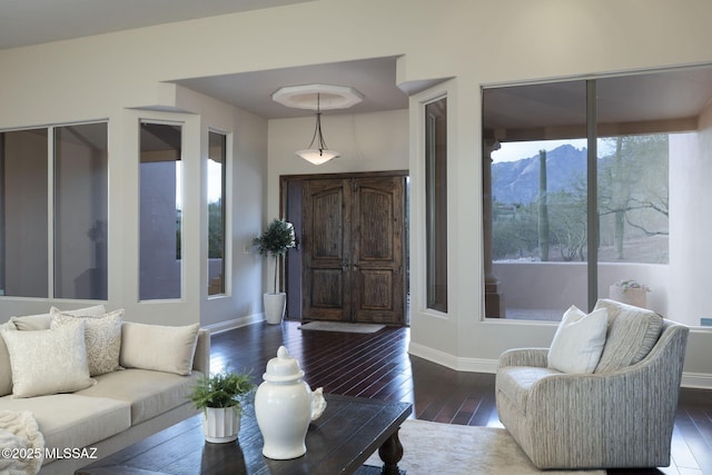3750 E Sumo Quinto, Tucson, AZ 85718 - living area featuring a mountain view, wood-type flooring, and baseboards