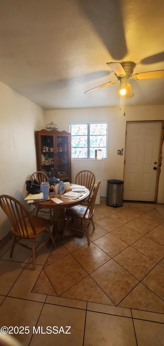 626 W Santa Paula St, Tucson, AZ 85706 - dining space with light tile patterned floors and ceiling fan