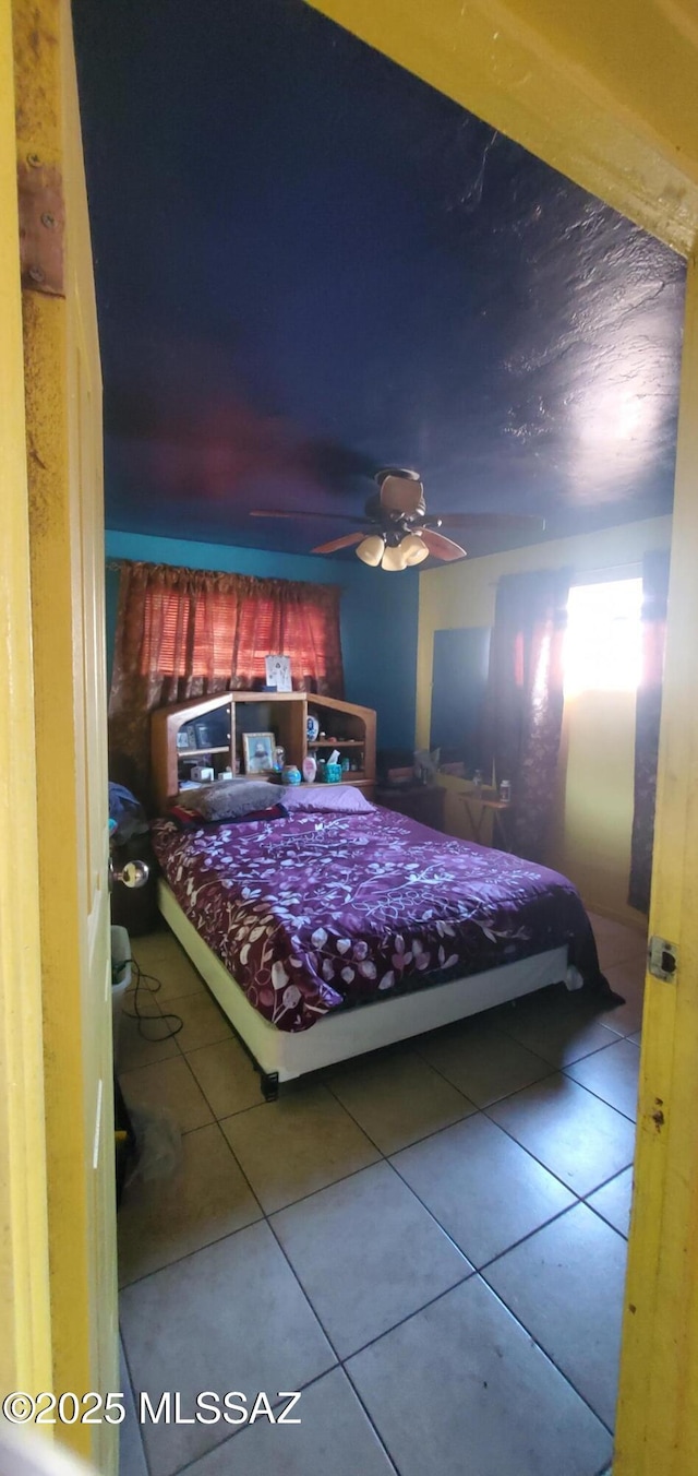 626 W Santa Paula St, Tucson, AZ 85706 - tiled bedroom featuring a ceiling fan