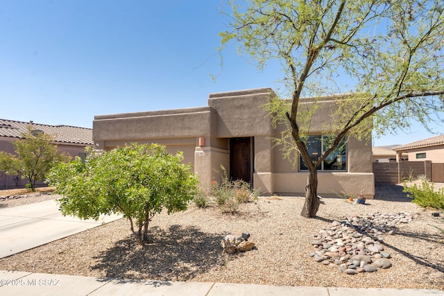 7511 W Sweet River Rd, Tucson, AZ 85743 - adobe home featuring stucco siding and an attached garage