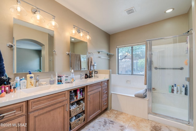 7511 W Sweet River Rd, Tucson, AZ 85743 - full bathroom with double vanity, a garden tub, a shower stall, and tile patterned flooring