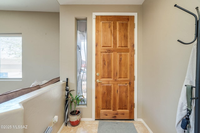 7511 W Sweet River Rd, Tucson, AZ 85743 - tiled foyer featuring baseboards