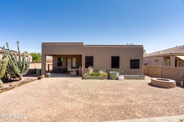 7511 W Sweet River Rd, Tucson, AZ 85743 - back of house featuring a patio, a fenced backyard, stucco siding, and cooling unit