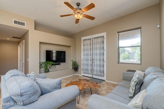 7511 W Sweet River Rd, Tucson, AZ 85743 - tiled living area with ceiling fan and baseboards