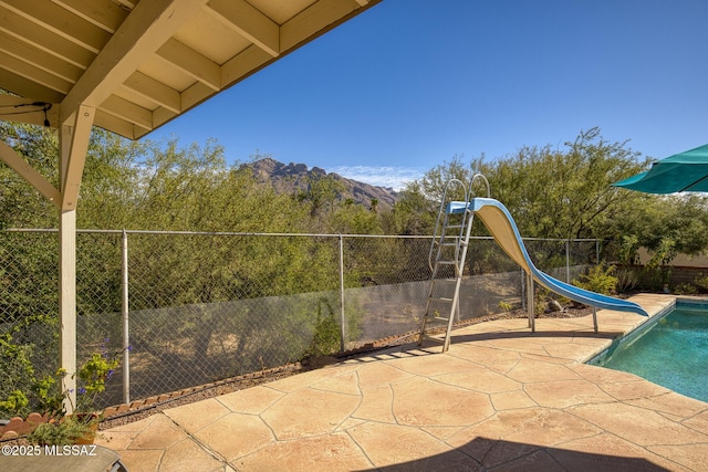 8628 N Placita Del Cardo, Tucson, AZ 85704 - fenced backyard featuring a patio and a mountain view