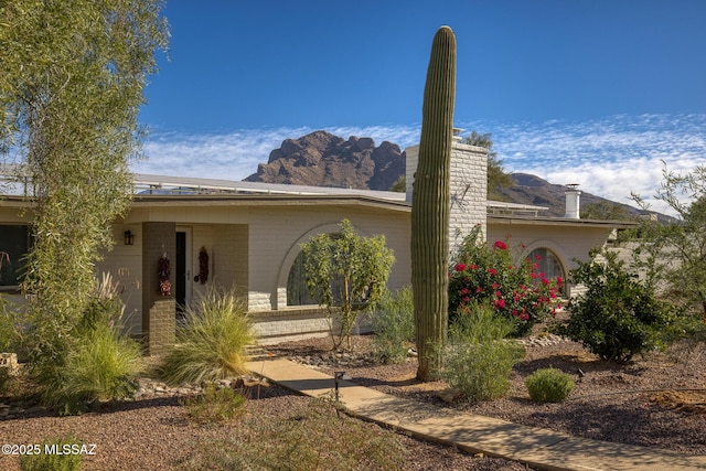 8628 N Placita Del Cardo, Tucson, AZ 85704 - ranch-style home featuring a mountain view and a chimney