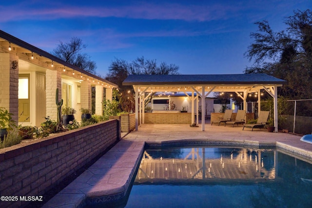 8628 N Placita Del Cardo, Tucson, AZ 85704 - view of swimming pool featuring a patio, a gazebo, and an outdoor kitchen