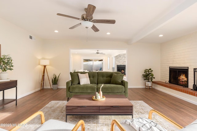 8628 N Placita Del Cardo, Tucson, AZ 85704 - living area with a fireplace, a ceiling fan, baseboards, wood finished floors, and recessed lighting