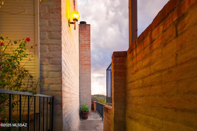 1900 E Campbell Ter, Tucson, AZ 85718 - view of side of home featuring a balcony