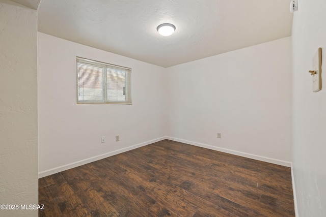 1716 S Sleepy Hollow Ave, Tucson, AZ 85710 - unfurnished room featuring dark wood-style flooring and baseboards