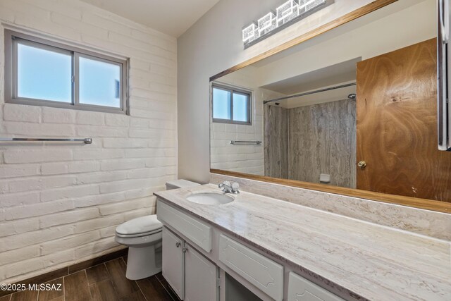 1716 S Sleepy Hollow Ave, Tucson, AZ 85710 - bathroom featuring vanity, toilet, a shower, and wood finished floors