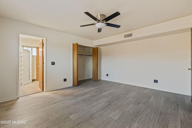 1716 S Sleepy Hollow Ave, Tucson, AZ 85710 - unfurnished bedroom featuring wood finished floors, a ceiling fan, a closet, and baseboards