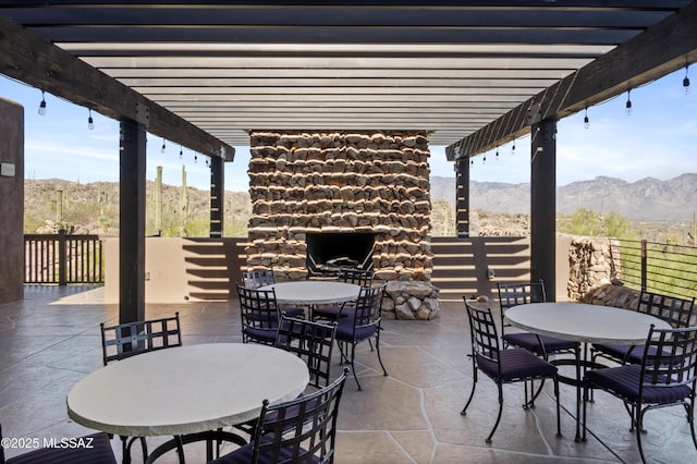 13935 Old Ranch House Rd, Marana, AZ 85658 - view of patio featuring outdoor dining area, a pergola, and a mountain view