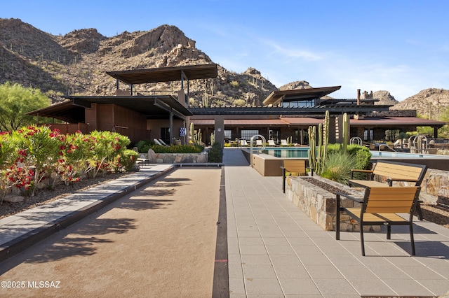 13935 Old Ranch House Rd, Marana, AZ 85658 - view of patio featuring a mountain view, an outdoor pool, and a game area
