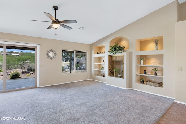 37358 S Ridgeview Blvd, Saddlebrooke, AZ 85739 - unfurnished living room featuring built in shelves, healthy amount of natural light, ceiling fan, baseboards, and high vaulted ceiling
