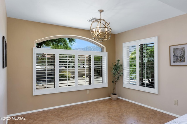 37358 S Ridgeview Blvd, Saddlebrooke, AZ 85739 - empty room with a chandelier, tile patterned floors, and baseboards